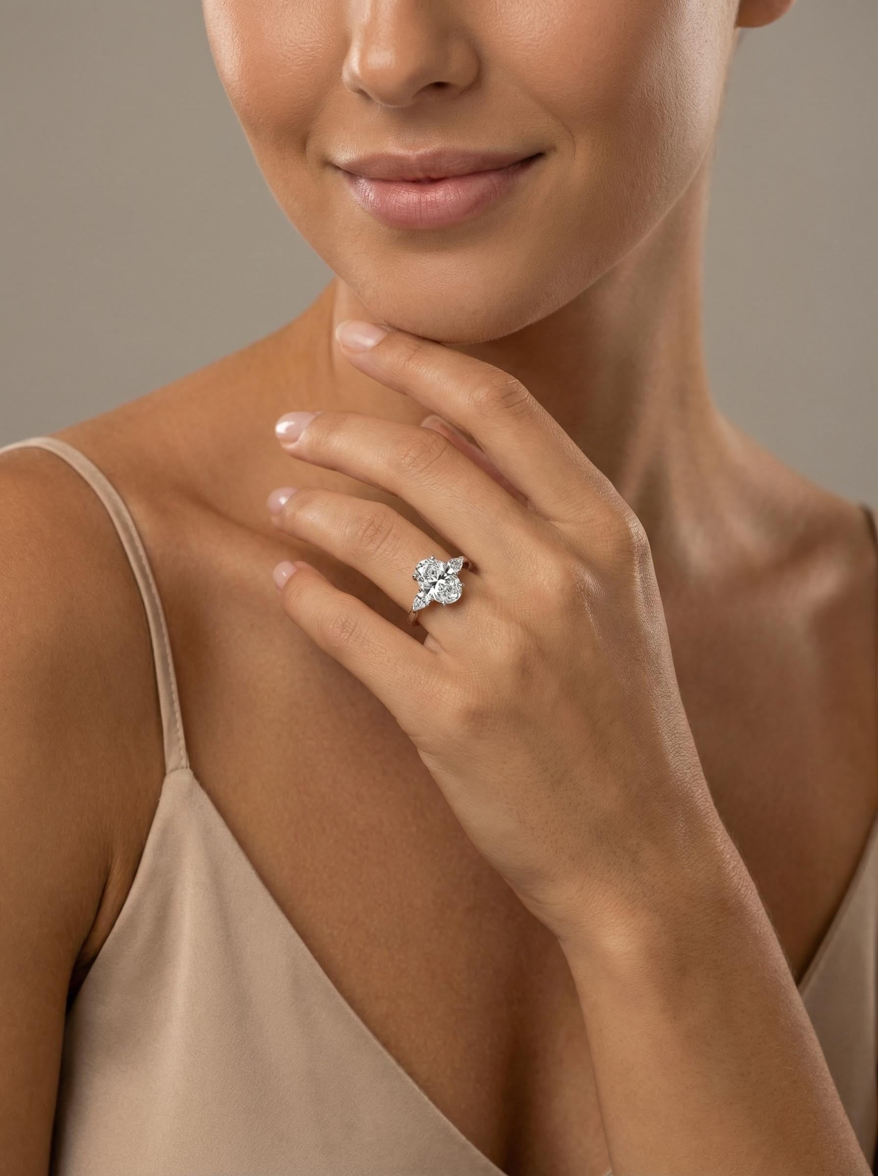Oval Three-Stone Marquise Ring